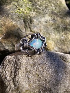 Rainbow flash Opal wrapped up in 925 sterling. Inspired by celtic ring work! Oxidized and polished. Celtic Ring, Celtic Rings, Opal Ring, Ring Size 7, Opal Rings, Rings Statement, Favorite Jewelry, Statement Rings, Swirl