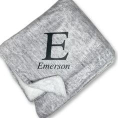 the personalized blanket is shown with a bow on it's head and an emersonon logo