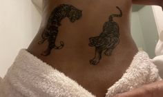 a person with a tiger tattoo on their stomach