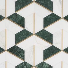 an abstract marble pattern with gold and green accents on it's sides, in shades of white and dark green