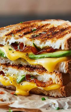 a grilled cheese sandwich with bacon, lettuce and tomato on toasted bread