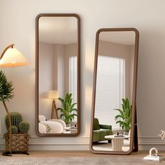 a living room with two mirrors on the wall