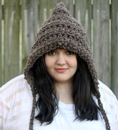 This chunky hooded hat in barley brown with braided ties makes the perfect winter accessory.  It is made of a soft mixture of lamb's wool and acrylic and is so nice and warm, it really goes great with any outfit.  If you would like this in a different color just choose your color from the color chart in the last picture and leave your selection in the notes to seller section during checkout.  Care:  Machine wash in cold, wrap in a towel and wring gently and lay flat to dry. Adjustable Cozy Brown Hat, Winter Brown Yarn Bonnet, Brown Yarn Bonnet Hat, Brown Outdoor Crochet Hat, Handmade Brown Bonnet For Winter, Handmade Brown Winter Bonnet, Brown Handmade Crochet Hat For Outdoor, Crochet Hat Winter, Hooded Hat