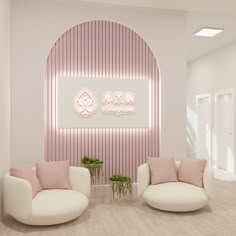 two white chairs and a pink couch in a room