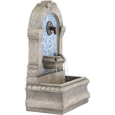 a water fountain with blue and white tiles on it