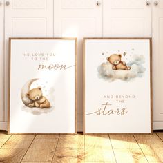 two posters with teddy bears on them in front of white cupboards and wooden floors