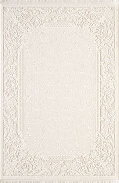 a white rug with an intricate design on it