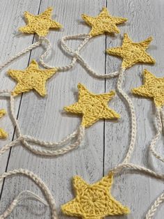 yellow crocheted stars on white string