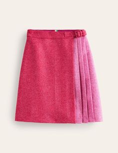 a pink skirt with pleaing on the front and side, sitting against a white background