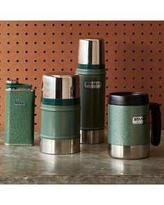 thermos are lined up next to each other