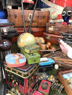 an assortment of antique suitcases and other items