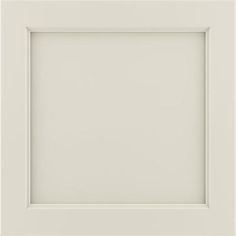 an empty white frame on a wall