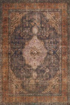 an antique rug with many different colors and patterns