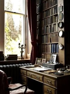 an old fashioned desk in front of a window