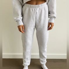 These Are High-Rise Sweatpants With A Slim Leg And Elastic Cuffs. They're Made With Tna’s Cozy Fleece Premium, Midweight Fleece With A Soft-Brushed Back, Sueded Face And Cloud-Nine Cozy Feel. They've Been Recently Redesigned For An Even More Flattering Fit. Winter Loungewear Sweats, Winter Long Joggers For Lounging, Winter Joggers For Lounging, Winter Cozy Joggers, Cozy Fit Winter Joggers, Cozy Fit Fleece Bottoms For Loungewear, Comfortable Fleece Bottoms For Loungewear, Gray Winter Sweatpants For Loungewear, Winter Joggers For Loungewear