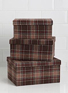 three plaid boxes stacked on top of each other