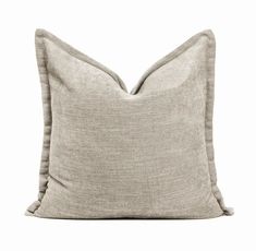 a beige pillow on a white background