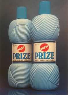 two blue balls of yarn sitting next to each other