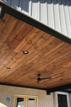 a ceiling fan on the outside of a house