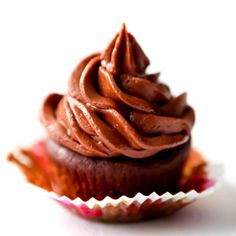 a cupcake with chocolate frosting on top