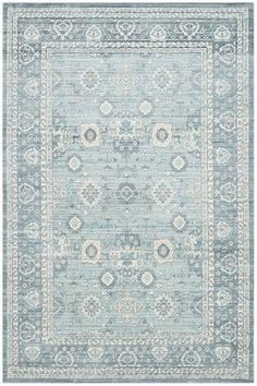 a light blue rug with an ornate design on the middle and bottom part of it