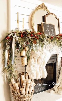 a fireplace mantel decorated with stockings, stockings and wreaths on top of it