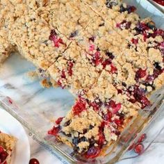 a close up of a pie with cranberries on the side