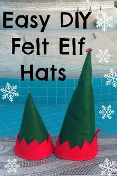 two elf hats sitting on top of a swimming pool