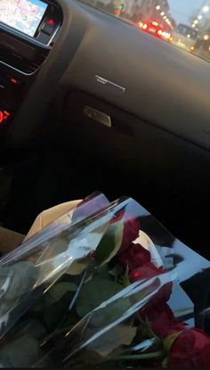 flowers are placed in the passenger seat of a car