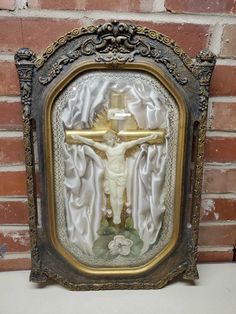 an ornate frame with a crucifix on it