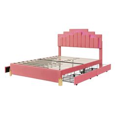 a pink bed frame with wooden slats