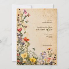 a wedding card with flowers on it