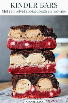 three red velvet dessert bars stacked on top of each other with peanut butter in the middle