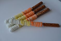 several candy sticks are arranged in the shape of carrots