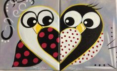 two owls sitting next to each other with hearts painted on them