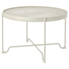 a white table with a metal frame and round design on the top, sitting against a white background