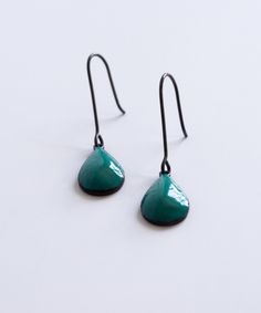 Teal and black dangle earrings Dangling Earrings Aesthetic, Green Nickel-free Teardrop Drop Earrings, Green Nickel-free Teardrop Earrings, Green Teardrop Drop Earrings Nickel Free, Single Green Enamel Earring, Green Enamel Single Earring, Modern Green Drop Jewelry, Green Drop Earrings Hypoallergenic, Green Drop Hypoallergenic Earrings