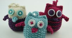 three knitted purses with googly eyes on them