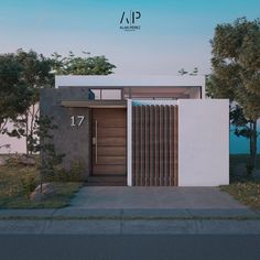 the front entrance to a modern home with wooden doors