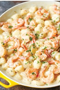 a skillet filled with shrimp and macaroni