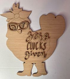 a wooden cutout of a chicken with glasses on it's head and the words herb chicks given