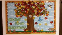 a bulletin board with an image of a tree and the words count your blessings