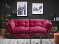 a living room scene with focus on the couch and coffee table in the foreground