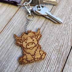 a wooden keychain with an animal design on it