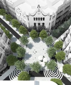 an aerial view of a courtyard with trees and buildings in the background, from above