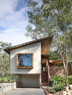 a modern house in the middle of a park