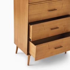 a wooden dresser with three drawers on one side and an open drawer on the other