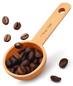 a wooden spoon filled with coffee beans