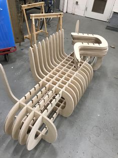 a bench made out of wood sitting in a garage