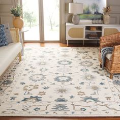 a living room filled with furniture and a white rug